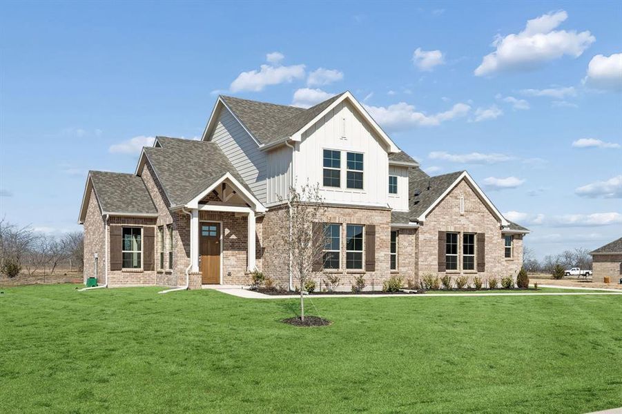 Front exterior of a new home in Ellis Ranch Estates, Waxahachie, TX, highlighting curb appeal (Image 2). Front exterior of a new home in Ellis Ranch Estates, Waxahachie, TX, highlighting curb appeal (Image 2).