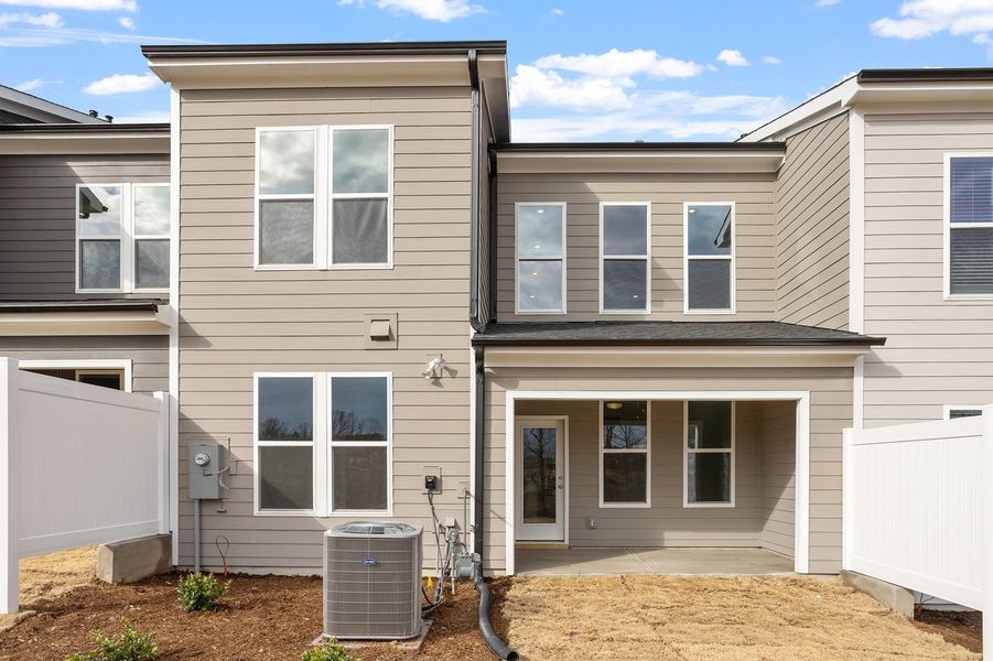 Exterior details and patio area of a home in Ovation at Sweetbrier, Durham (Image 21).