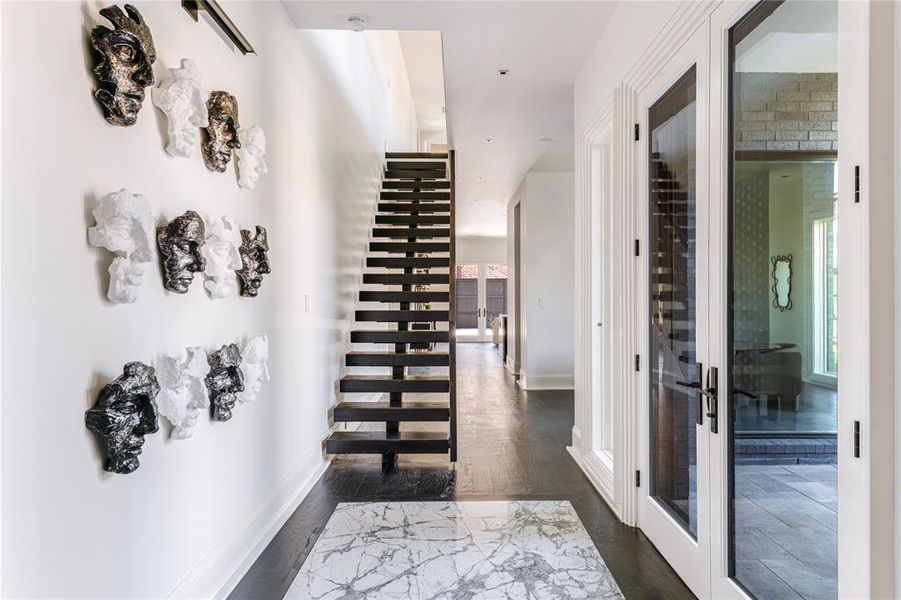 Front Foyer with view of stairs and Dining Hallway
