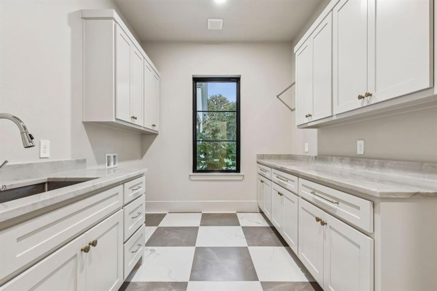 Washroom with hookup for a washing machine and cabinet space