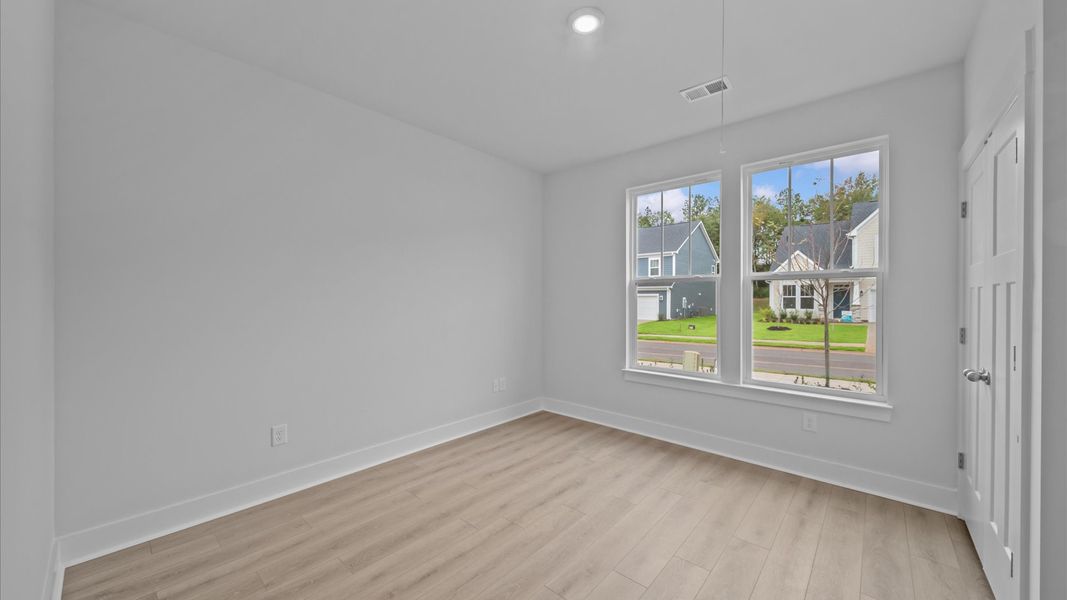 Elegant hardwood floors extend into spacious, light-filled secondary bedrooms Elegant hardwood floors extend into spacious, light-filled secondary bedrooms