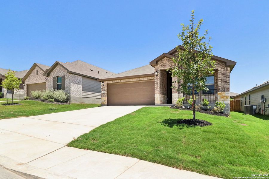 Front exterior of a new home in Scenic Crest - Premier Series, Boerne, TX, highlighting curb appeal (Image 24). Front exterior of a new home in Scenic Crest - Premier Series, Boerne, TX, highlighting curb appeal (Image 24).