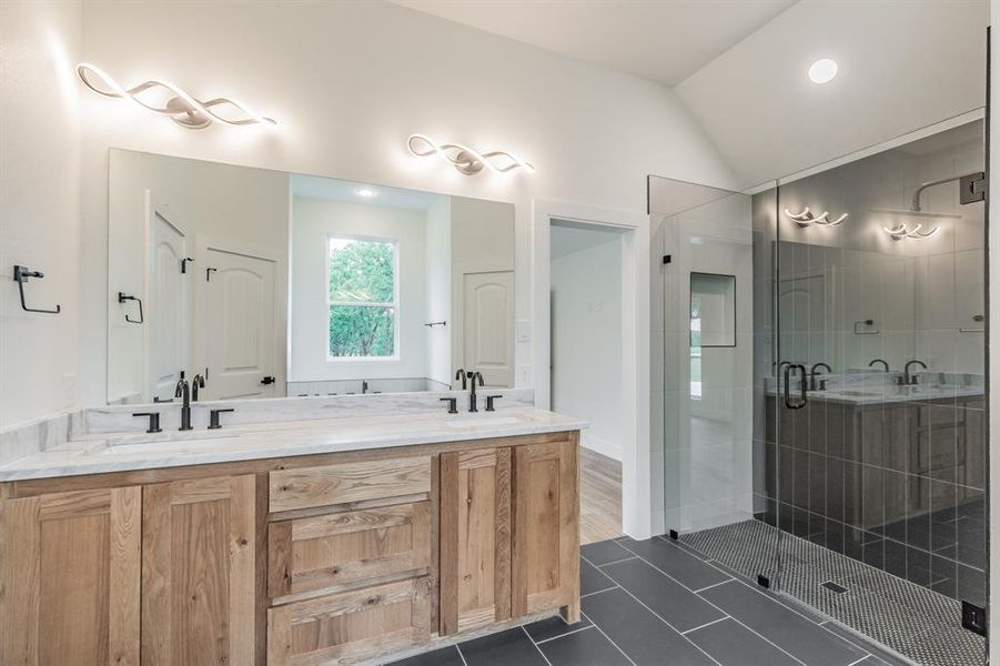 Full bath with a shower stall, double vanity, tile patterned flooring, lofted ceiling, and recessed lighting