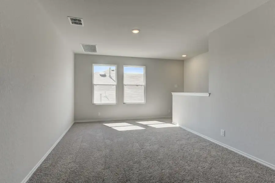 Representative unfurnished interior of a home built from the Cassidy by Ashton Woods in Saddlebrook Ranch, Schertz (Image 20).