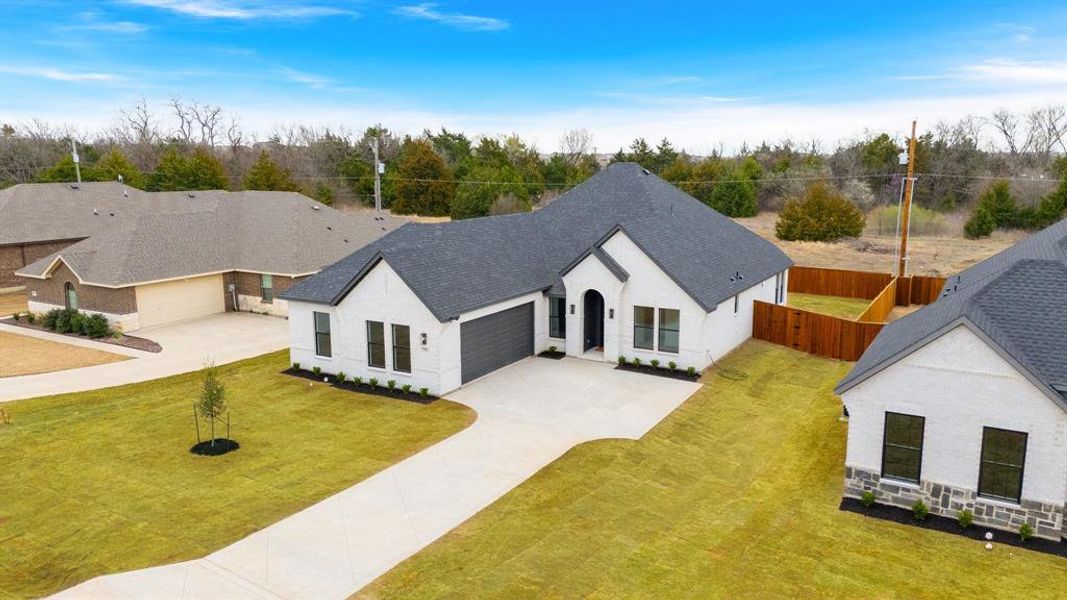 Front exterior of a new home in , Glenn Heights, TX, highlighting curb appeal (Image 20).