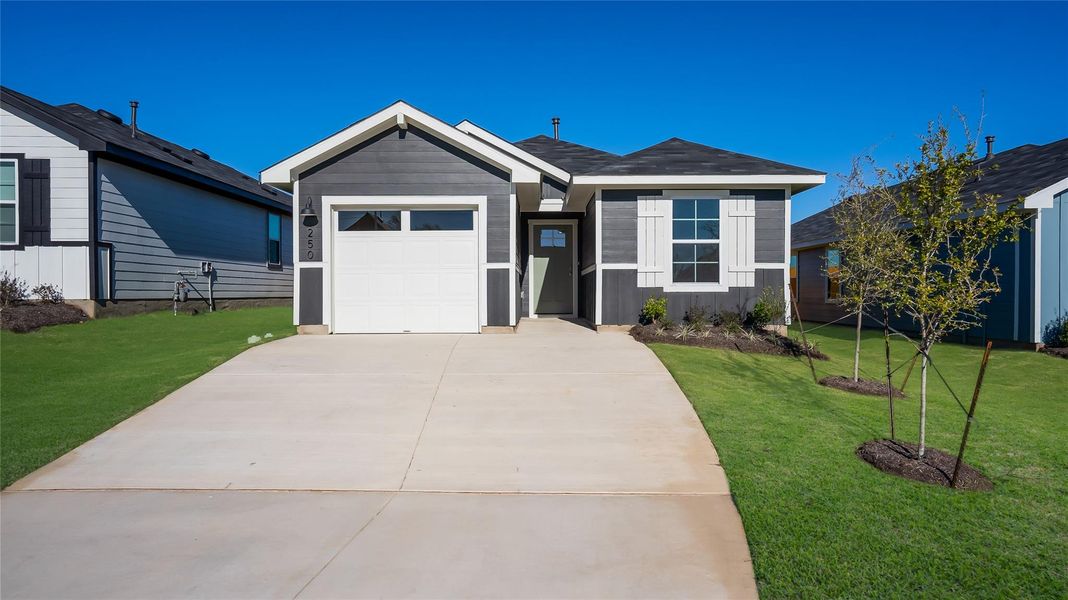 Front exterior of a new home in Marigold, Uhland, TX, highlighting curb appeal (Image 14). Front exterior of a new home in Marigold, Uhland, TX, highlighting curb appeal (Image 14).