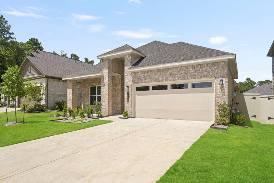 Front exterior of a new home in Audubon, Magnolia, TX, highlighting curb appeal (Image 19). Front exterior of a new home in Audubon, Magnolia, TX, highlighting curb appeal (Image 19).