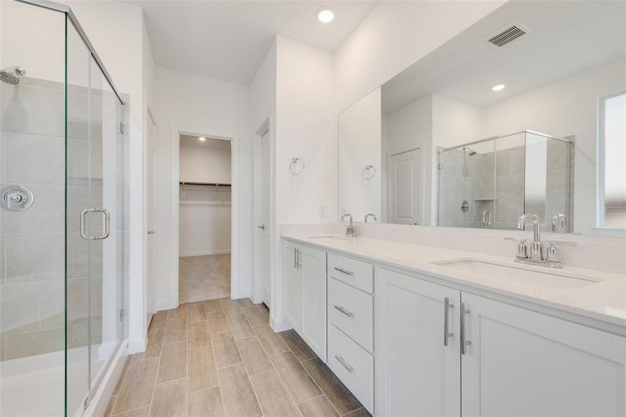 Bathroom with vanity and walk in shower