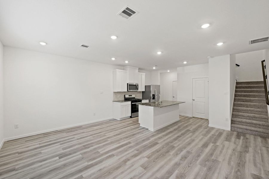 Furnished interior view inside a new home in Bridges on Lake Houston Villas, Humble (Image 12).