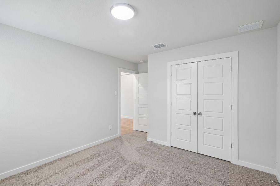 Bedroom in the Hayden home plan by Trophy Signature Homes
