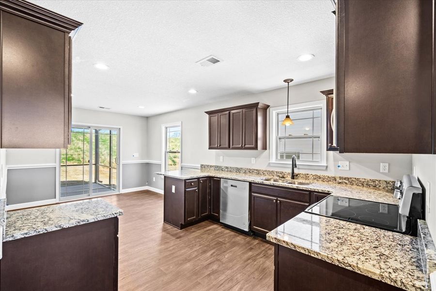 Representative furnished interior of a home built from the Wellford by Enchanted Homes in Hampshire Heights, Moore (Image 6).