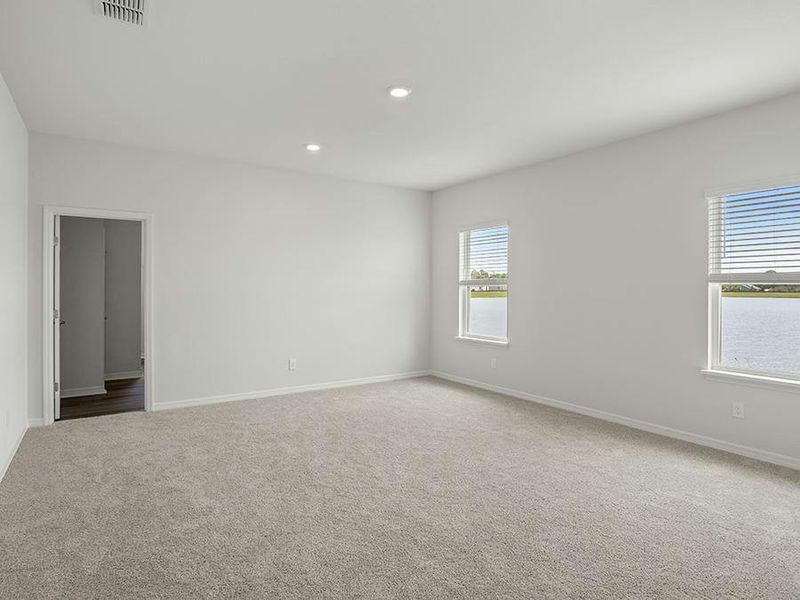 Your spacious owner`s suite looks out at the lake.