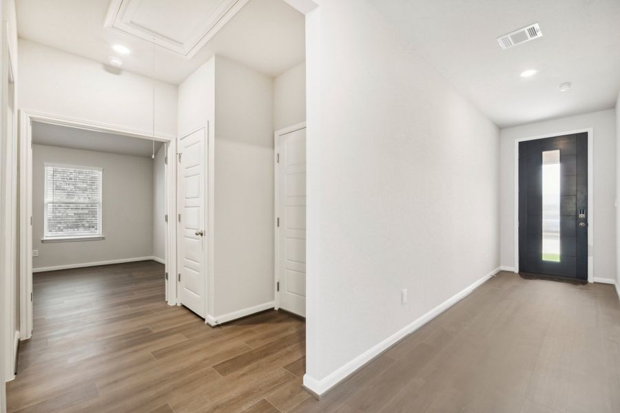 Hallway and entry in the Fitzhugh floorplan in a Meritage Homes community.