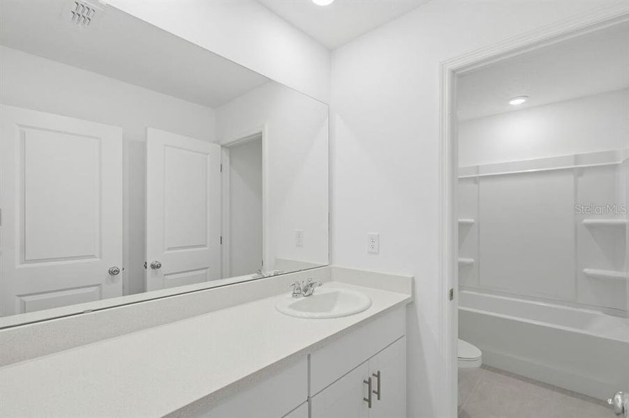 Furnished interior view inside a new home in Waterstone, Groveland (Image 7).