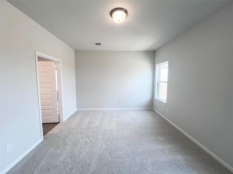 The Waring III- Primary Bedroom Suite. Sample image for illustration; upgrades, options, and colors may vary.