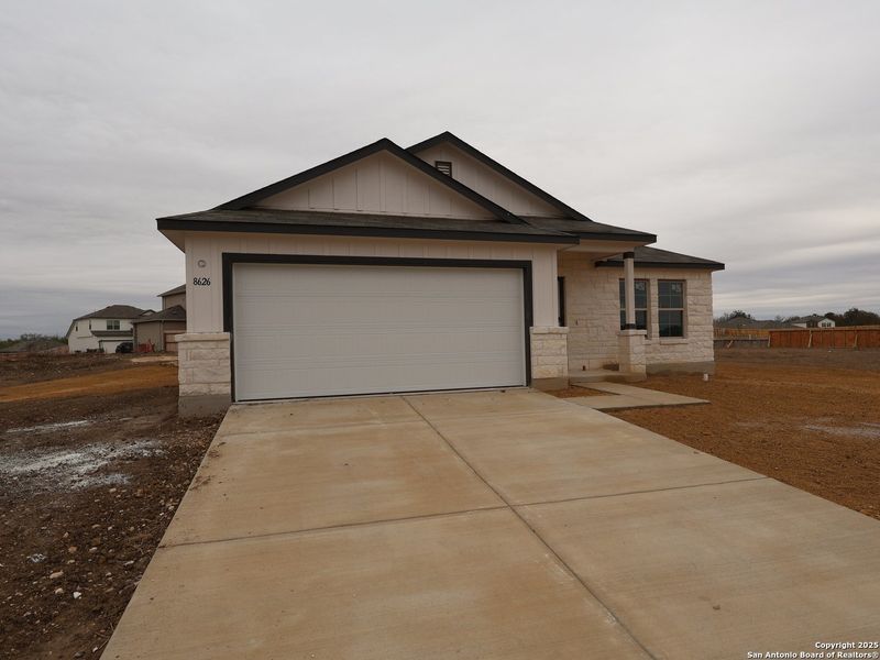 Front exterior of a new home in Cinco Lakes, San Antonio, TX, highlighting curb appeal (Image 1). Front exterior of a new home in Cinco Lakes, San Antonio, TX, highlighting curb appeal (Image 1).