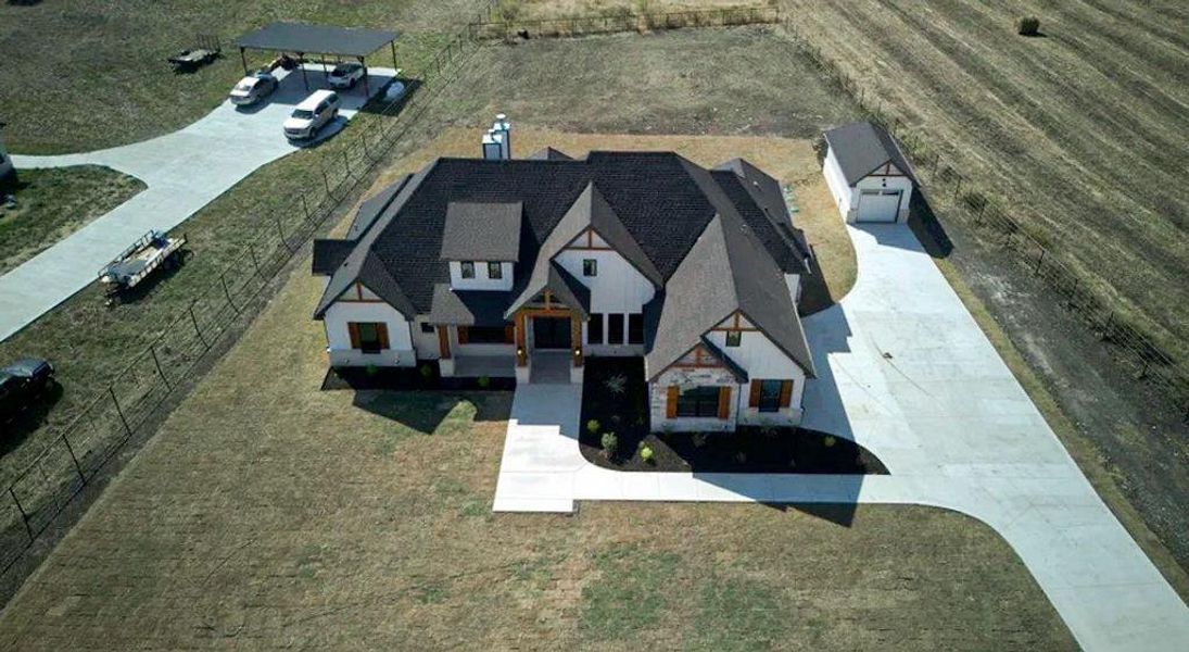 Front exterior of a new home in , Waxahachie, TX, highlighting curb appeal (Image 24).