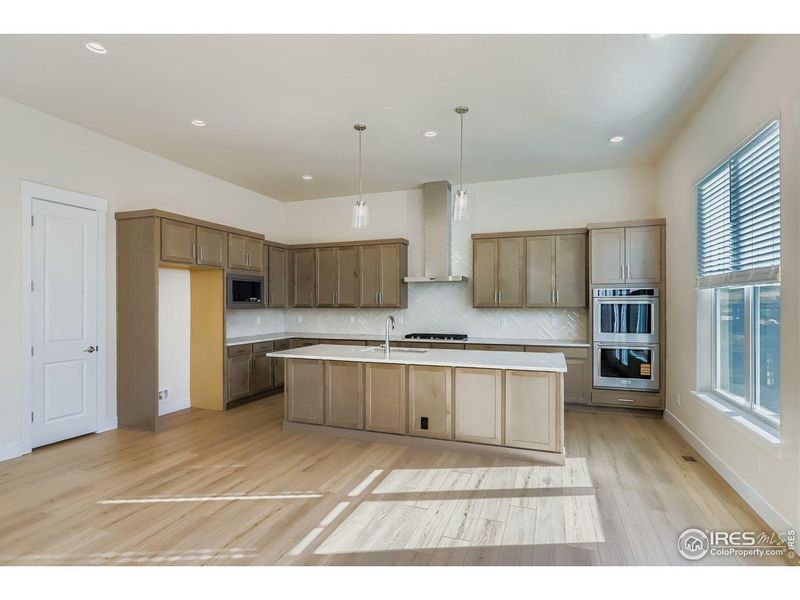 Furnished interior view inside a new home in RainDance, Windsor (Image 9).