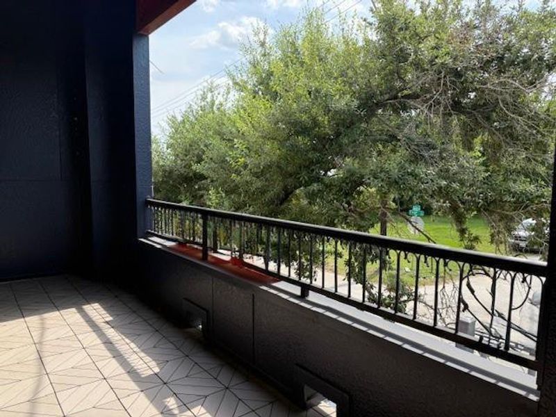 Huge balcony and it sure is nice to see green out your windows in the city and have a barrier from the Texas sun!