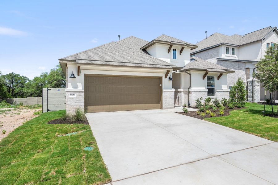 Front exterior of a new home in Wolf Ranch, Georgetown, TX, highlighting curb appeal (Image 24).