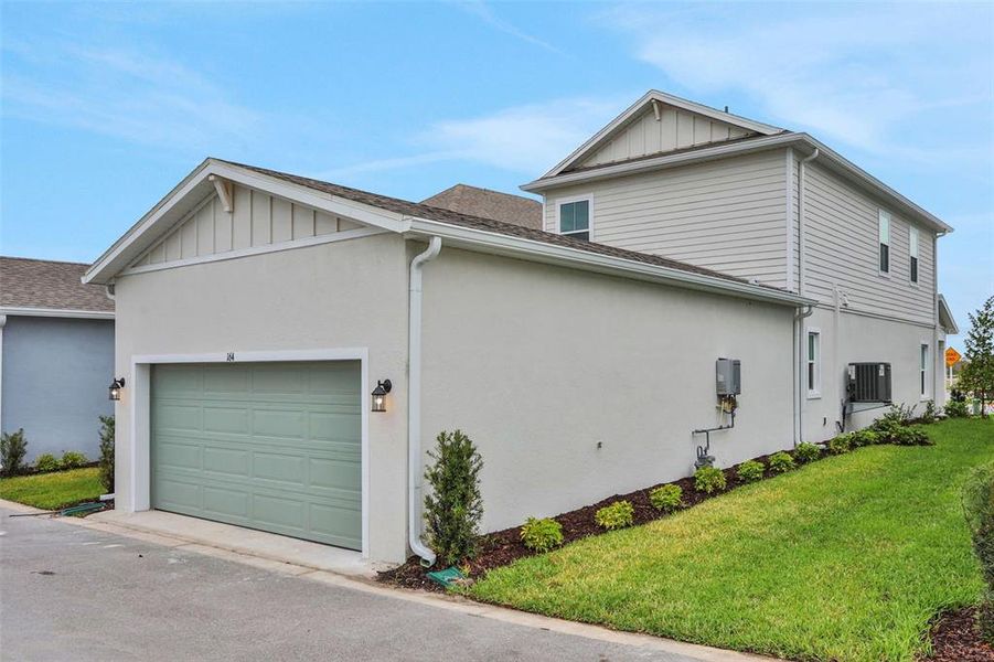 Front exterior of a new home in Bungalow Walk at Lakewood Ranch, Sarasota, FL, highlighting curb appeal (Image 17).