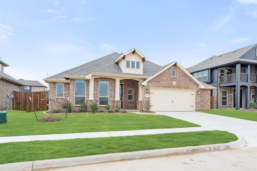 Front exterior of a new home in Hampton Park, Glenn Heights, TX, highlighting curb appeal (Image 26). Front exterior of a new home in Hampton Park, Glenn Heights, TX, highlighting curb appeal (Image 26).
