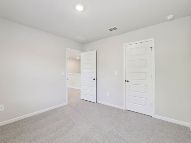 Spacious, unfurnished interior of a new home in Vines at Mill Creek - Estate Series, Braselton (Image 22).