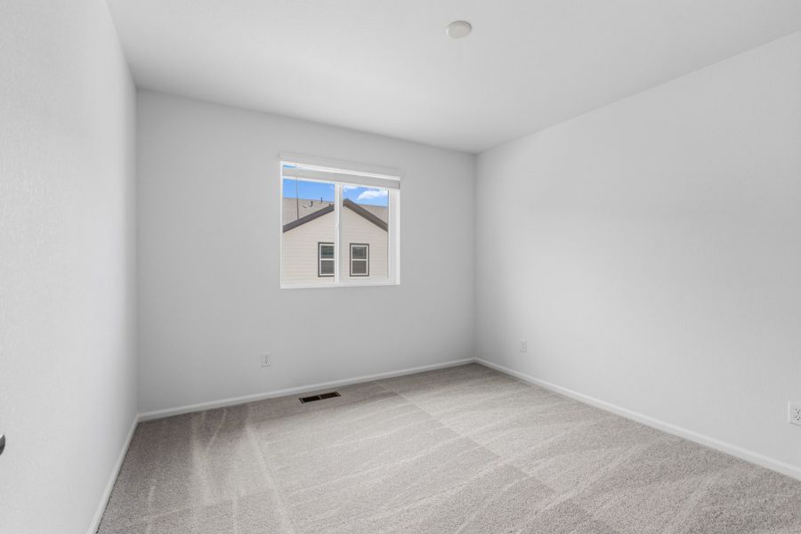 Spacious, unfurnished interior of a new home in Woodrose at Painted Prairie, Aurora (Image 17).