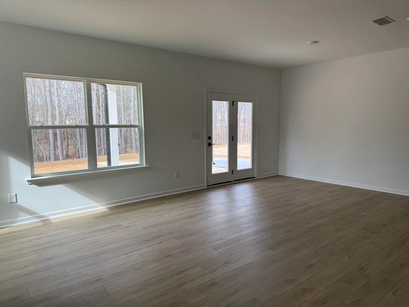 Family Room featuring the AW Collection® Serene - Open space with natural finishes and light. Family Room featuring the AW Collection® Serene - Open space with natural finishes and light.