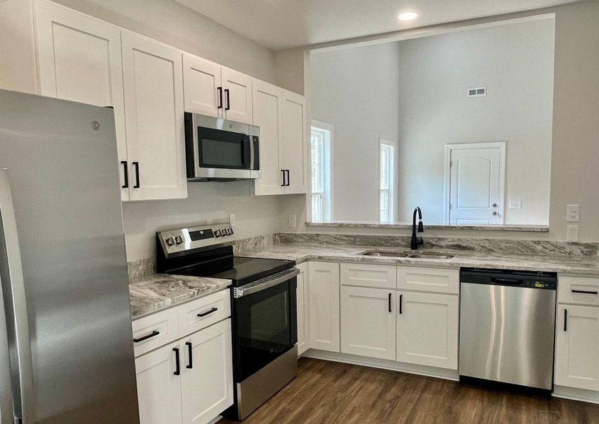 Furnished interior view inside a new home in , St. Stephen (Image 9).