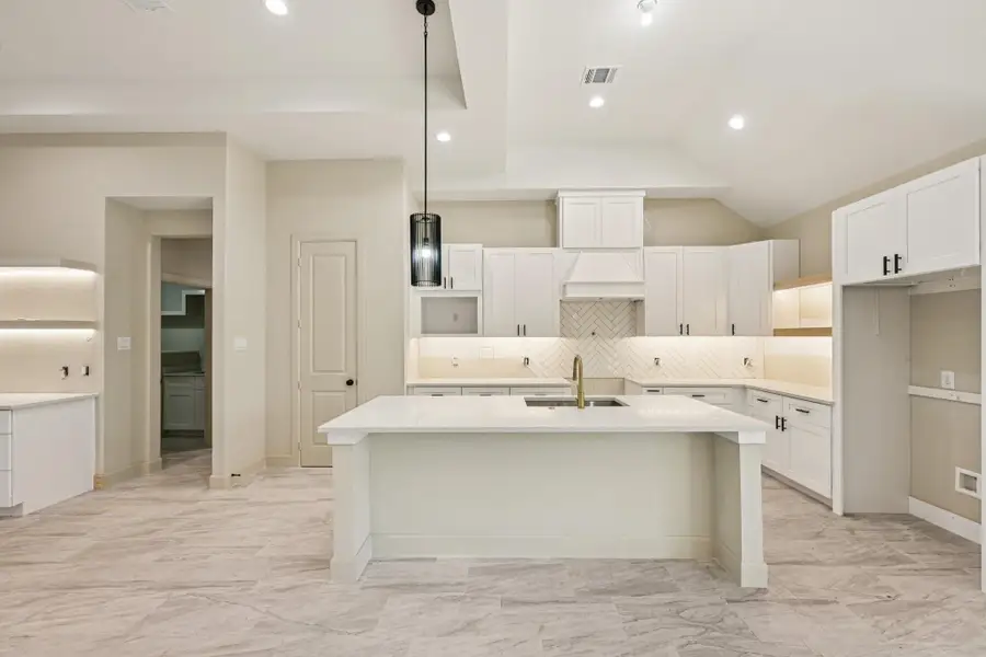 Large Kitchen Island. Ample storage and countertop space make it ideal for cooking and entertaining.