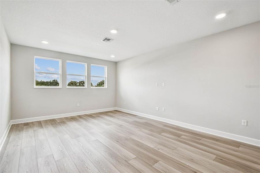 Spacious, unfurnished interior of a new home in Solace at Corner Lake, Orlando (Image 61).
