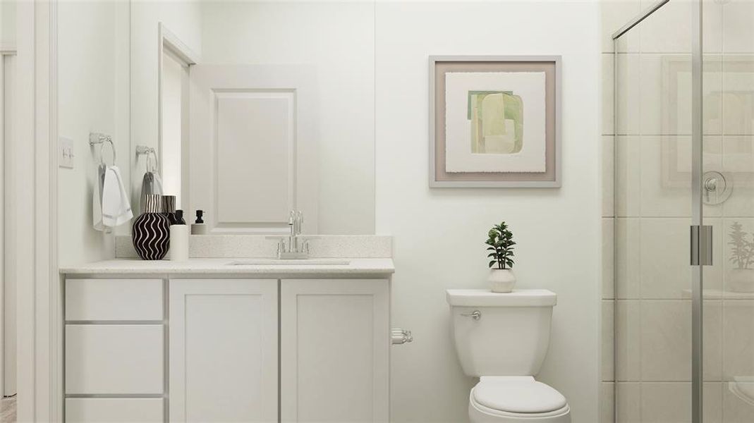 Bathroom featuring vanity, an enclosed shower, and toilet