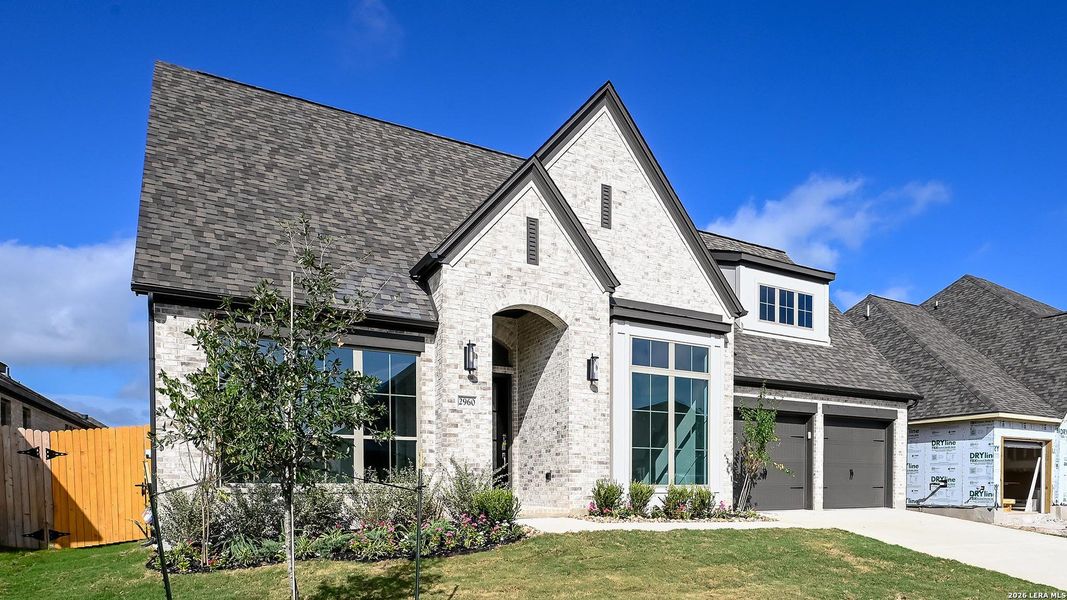 Front exterior of a new home in Meadows of Mill Creek, Seguin, TX, highlighting curb appeal (Image 2). Front exterior of a new home in Meadows of Mill Creek, Seguin, TX, highlighting curb appeal (Image 2).