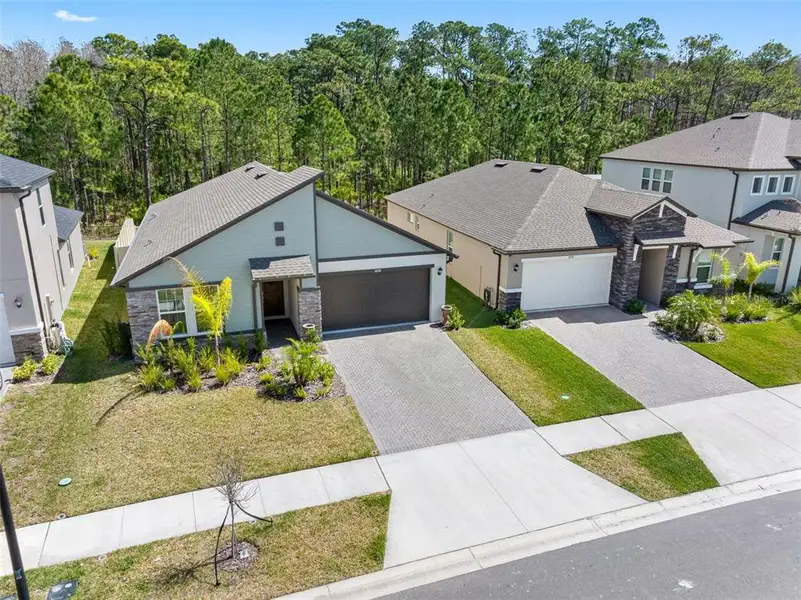 Front exterior of a new home in Pearl Estates, Lutz, FL, highlighting curb appeal (Image 1). Front exterior of a new home in Pearl Estates, Lutz, FL, highlighting curb appeal (Image 1).
