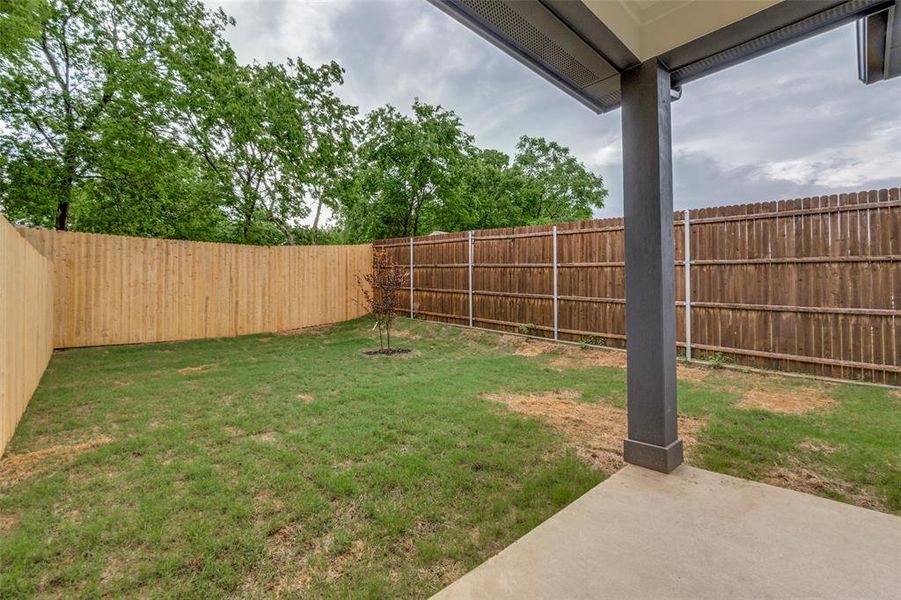 View of yard with a patio and a fenced backyard