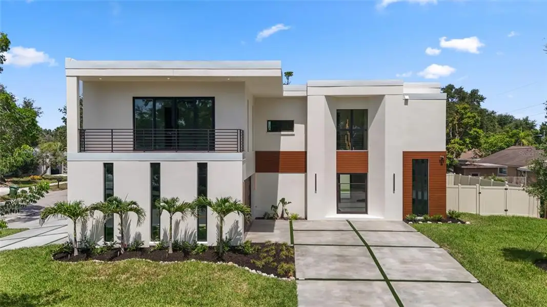 Front exterior of a new home in , Sarasota, FL, highlighting curb appeal (Image 27).