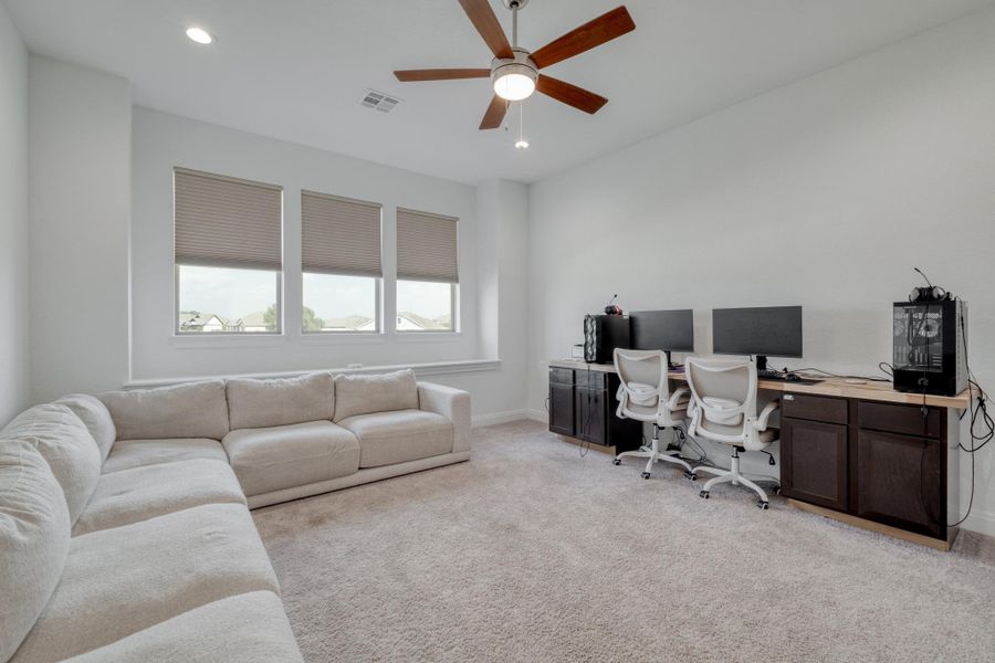 The game room has space for movie nights, gaming setups, homework stations, or all three.