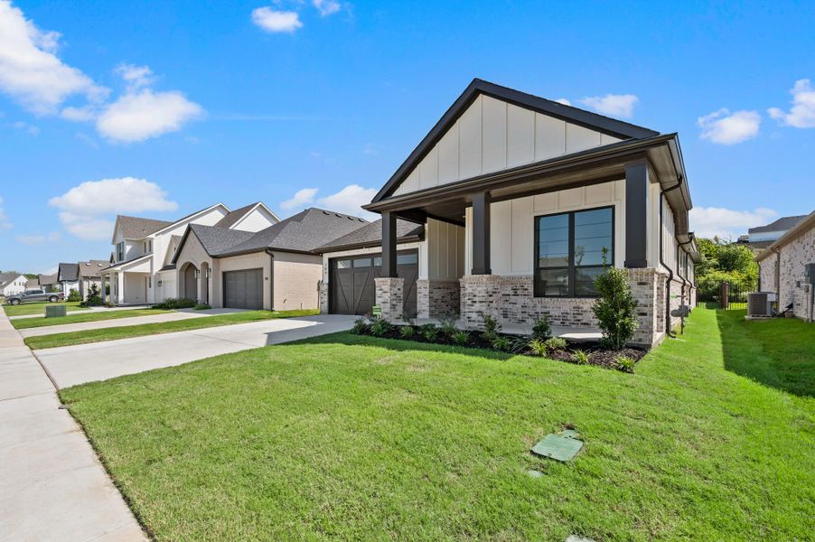 Front exterior of a new home in Parks of Aledo, Aledo, TX, highlighting curb appeal (Image 24).