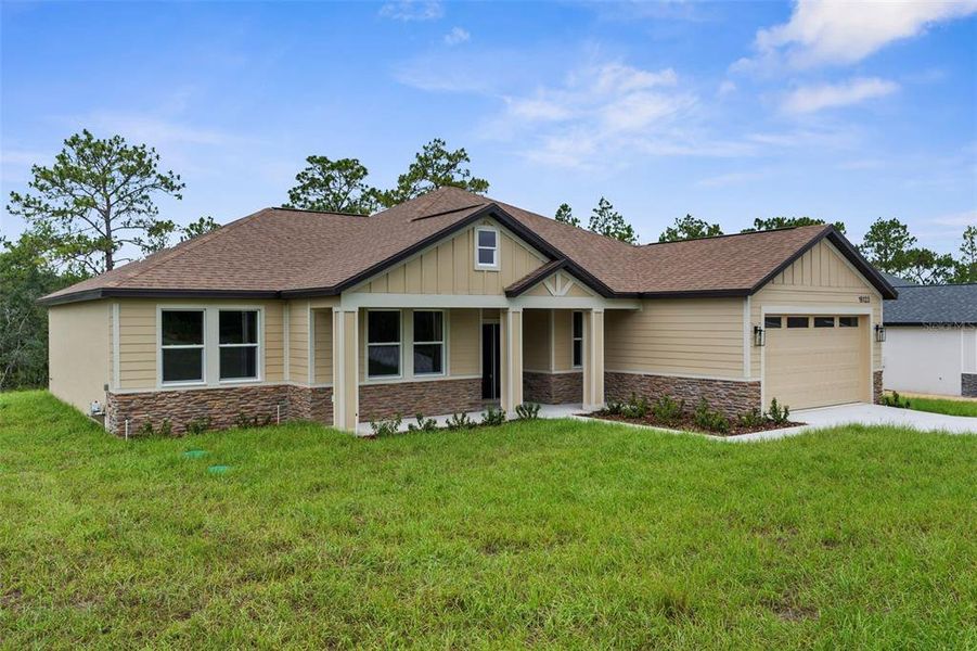 Front exterior of a new home in , Weeki Wachee, FL, highlighting curb appeal (Image 19).