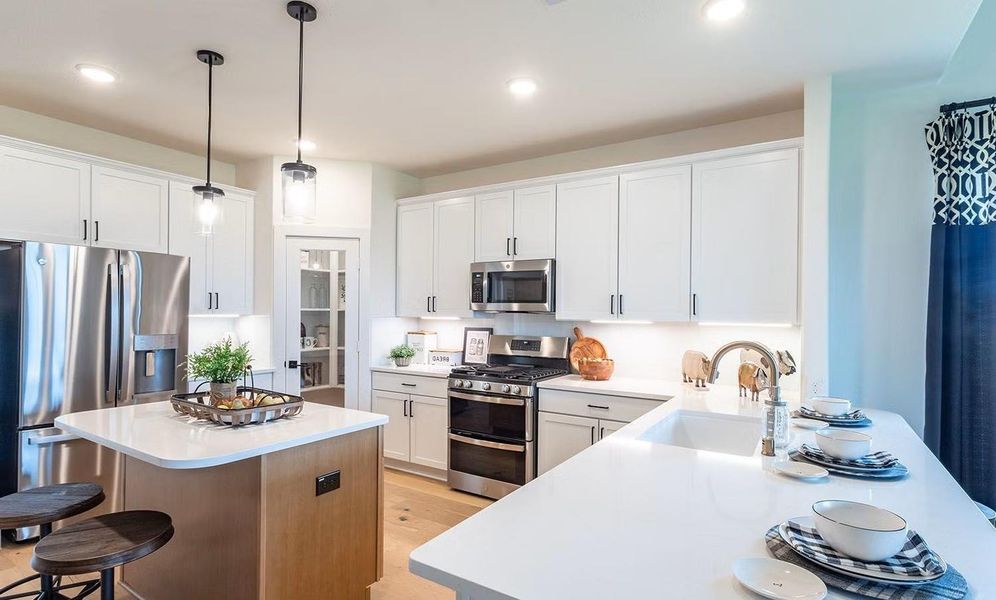 New SEMINOLE II Floor Plan by CastleRock Communities in the desirable Wildrye! This home is currently under construction and features a smart 2-story layout with 4 bedrooms, 2.5 baths, and a 2-car garage. Inviting gourmet kitchen featuring granite countertops, tall shaker style cabinetry, a center island, and a breakfast bar that opens to the family areas, ideal for daily living and entertaining. **Photos are representative only and may vary as built.** Home almost ready for photos!