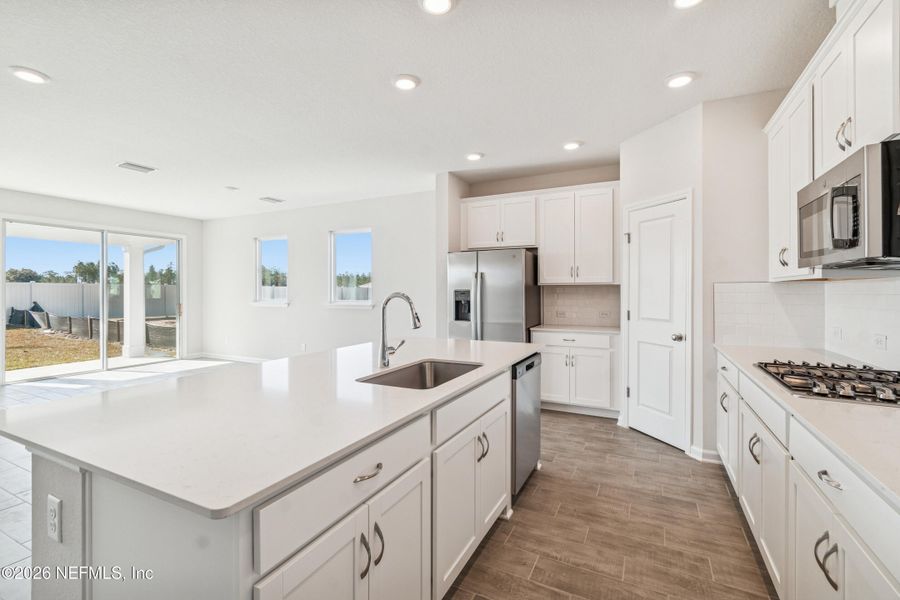 Furnished interior view inside a new home in Tributary 50', Yulee (Image 6).