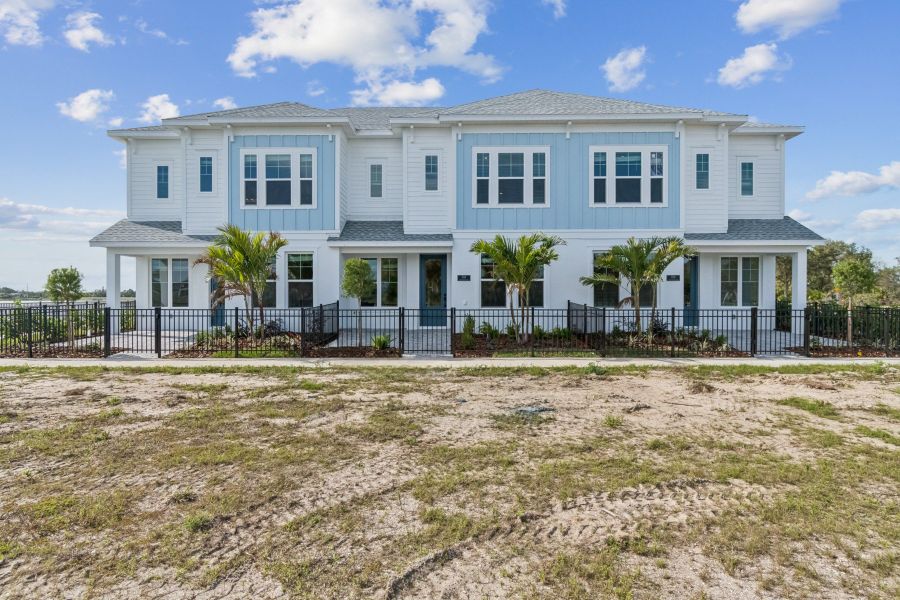 Exterior details and patio area of a home in Emerald Landing at Waterside at Lakewood Ranch – Towns, Sarasota (Image 4).