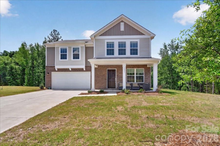 Front exterior of a new home in Walkers Mill, Edgemoor, SC, highlighting curb appeal (Image 1). Front exterior of a new home in Walkers Mill, Edgemoor, SC, highlighting curb appeal (Image 1).