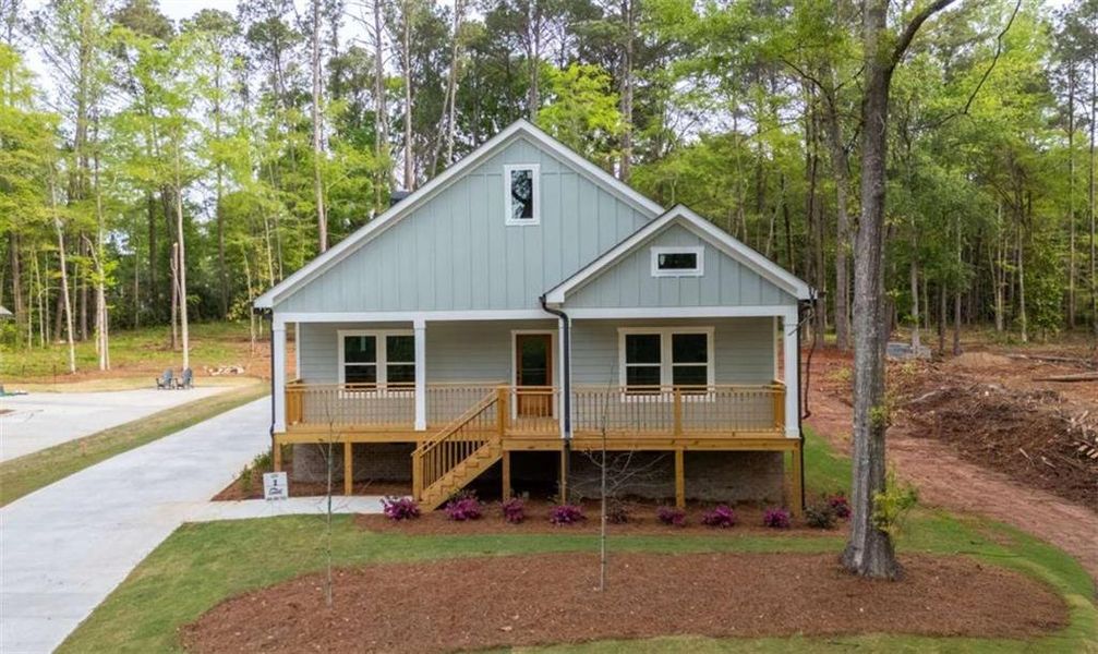 Front exterior of a new home in , Covington, GA, highlighting curb appeal (Image 1). Front exterior of a new home in , Covington, GA, highlighting curb appeal (Image 1).