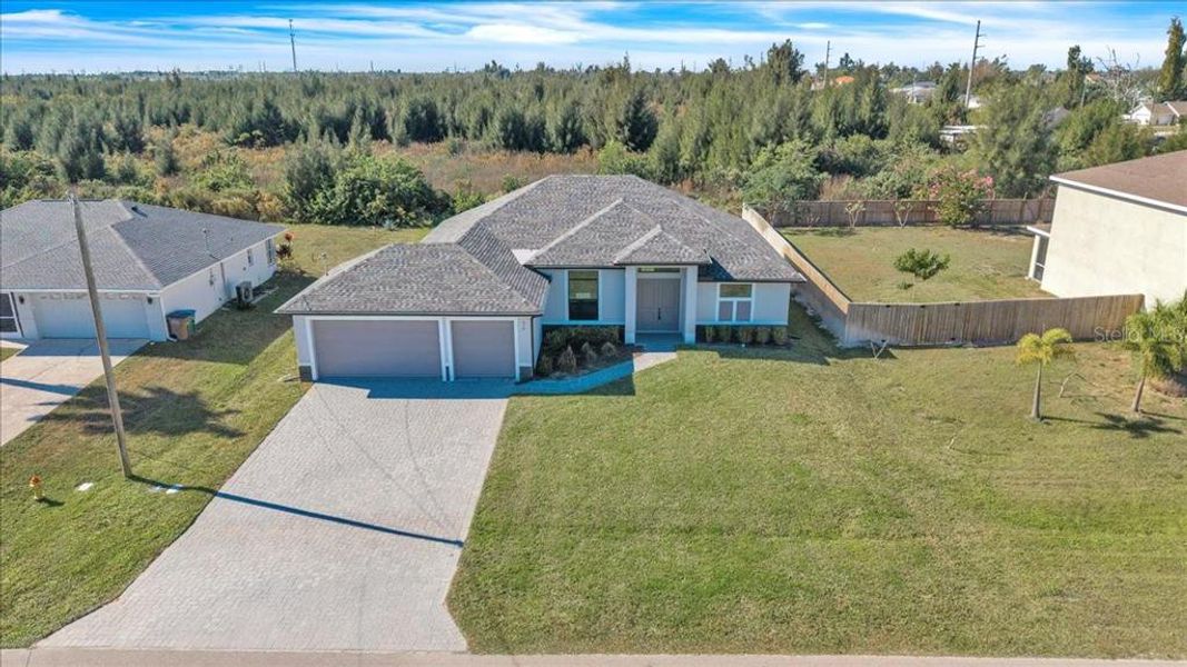 Front exterior of a new home in , Cape Coral, FL, highlighting curb appeal (Image 23).