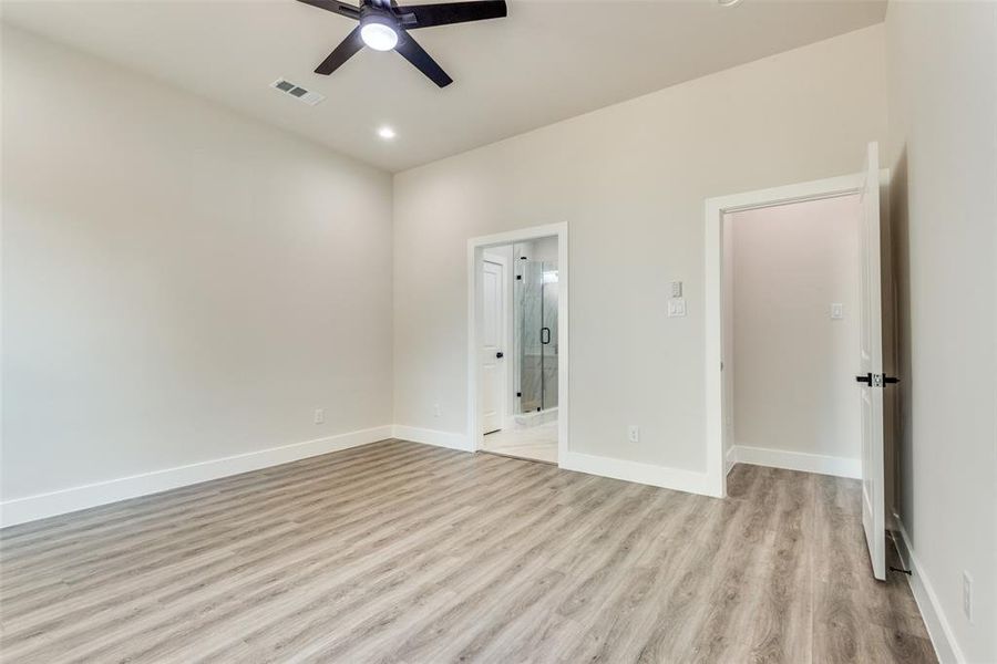 Unfurnished bedroom featuring light hardwood / wood-style floors and ceiling fan