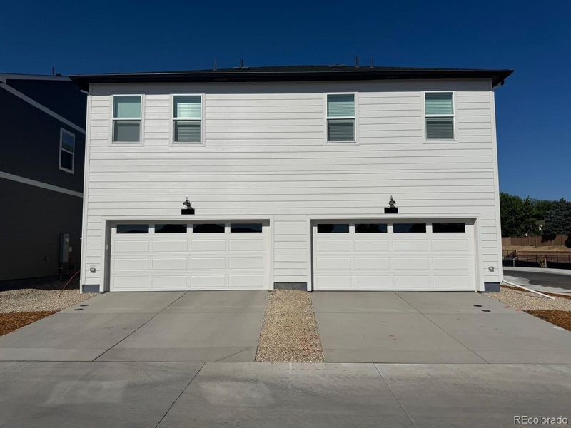 Front exterior of a new home in Arcadia, Denver, CO, highlighting curb appeal (Image 20).