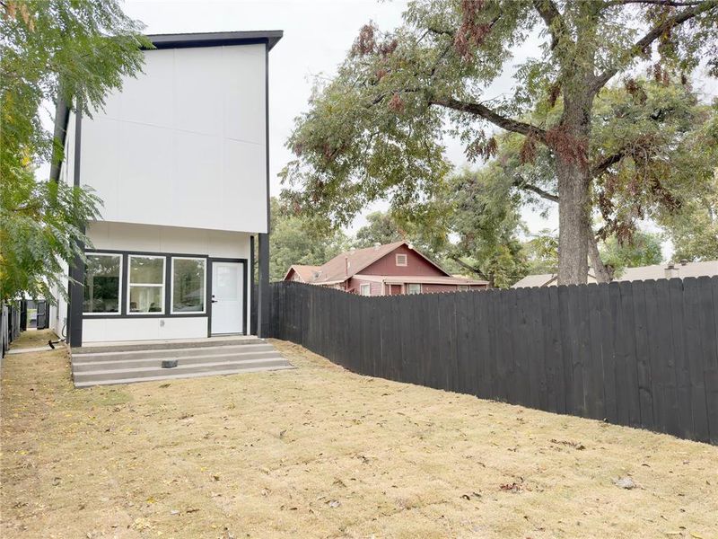 View of fenced backyard