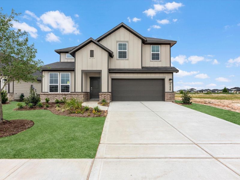Front exterior of a new home in Mason Woods, Cypress, TX, highlighting curb appeal (Image 2). Front exterior of a new home in Mason Woods, Cypress, TX, highlighting curb appeal (Image 2).